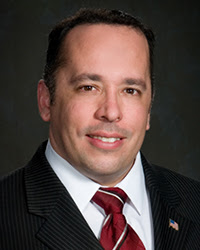 Cory A. Santos, Sr., '01