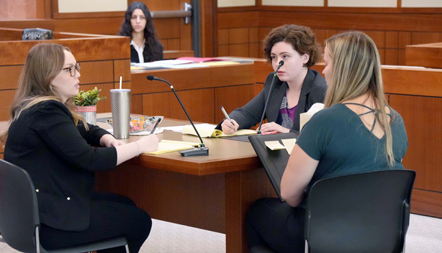 Photo of four students participating in client counseling competition